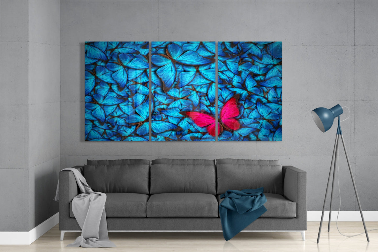 Multicolored butterfly artwork on a gray wall above a sofa