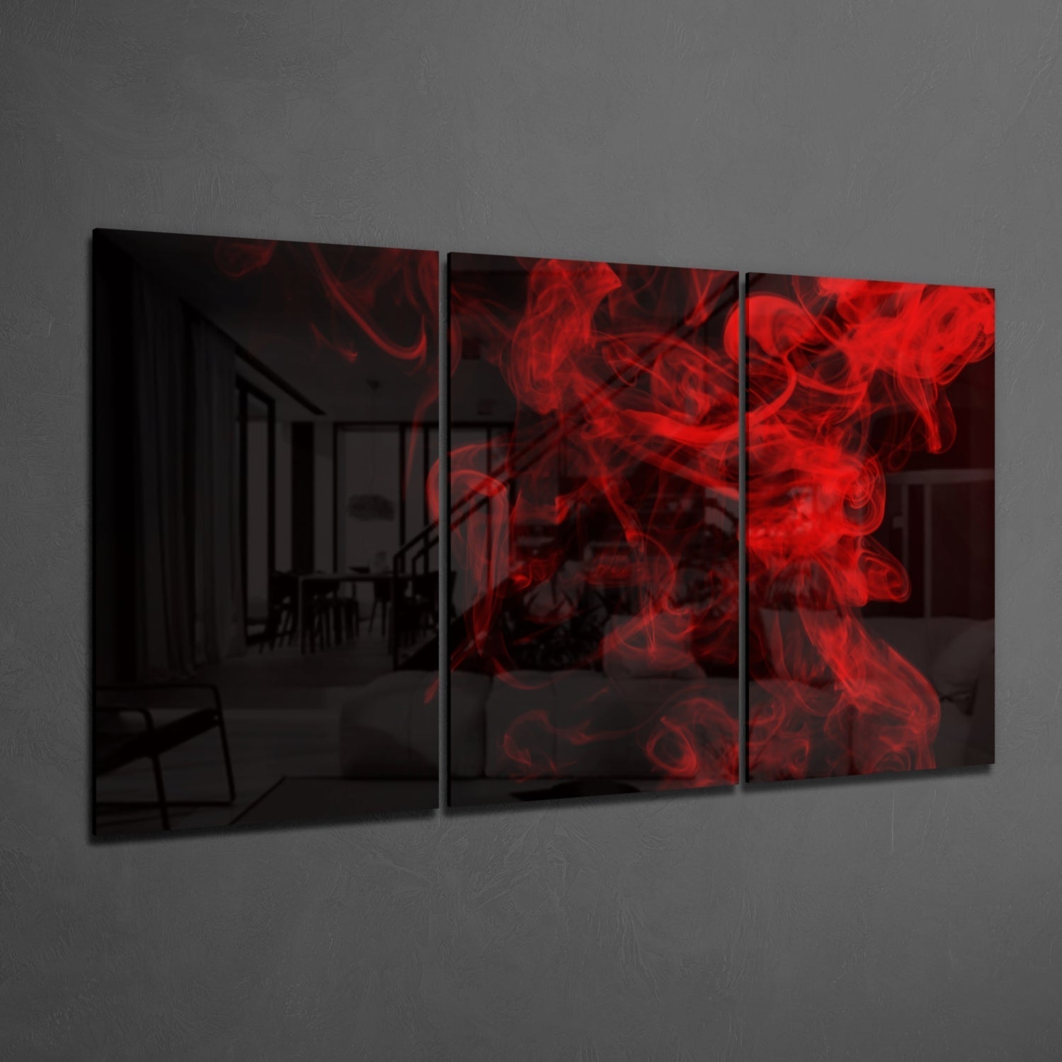 Three-panel wall art with red smoke design on a dark background