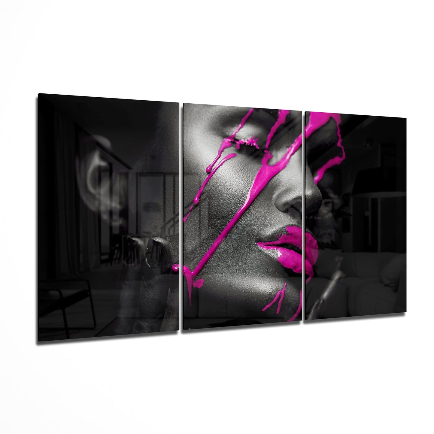 Triptych wall art of a stylized face with pink accents on a black background