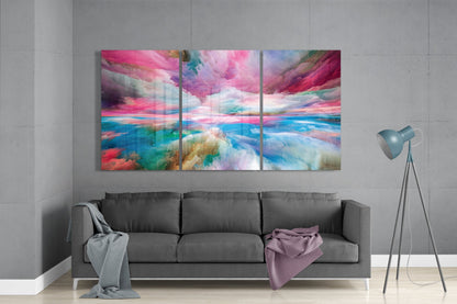 Colorful abstract wall art above a gray sofa in a room with a gray wall.